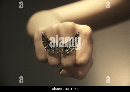 Woman's fist with a ring on it Stock Photo