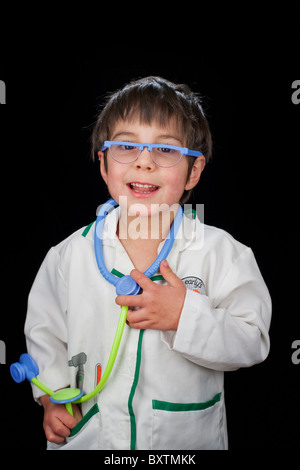 Portrait of 4 year old boy dressed as a doctor Stock Photo