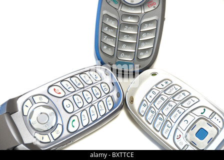Three wireless cell phones on white background Stock Photo