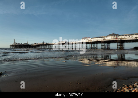 Brighton Pier lit by early morning sun. East Sussex UK. Stock Photo