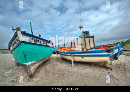 Fishing Boats on the Quay for Repairs and Maintenance in Struisbaai near Cape Agulhas The Southern most Point of Africa. Stock Photo