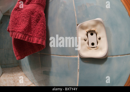 Electric wall outlet in dangerous melting process due to overheating ...