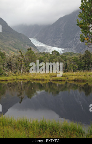 Franz Josef Glacier and Peters Pool in the Westland National Park South Island New Zealand Stock Photo