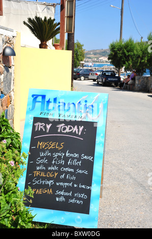 Restaurant menu chalk board outside a restaurant with local specialities - image taken in Greece Stock Photo