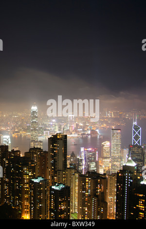 The amazing Hong Kong skyline as seen from above at night. Victoria harbor harbour and Kowloon Stock Photo