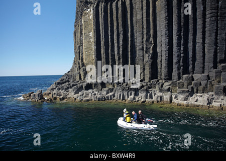 Boat and basalt columns at entrance to Fingal's Cave, Staffa, off Isle of Mull, Scotland, United Kingdom