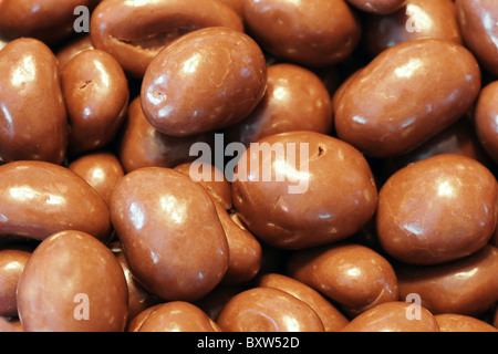 Chocolate covered almonds in French coin dispenser candy machines Stock  Photo - Alamy