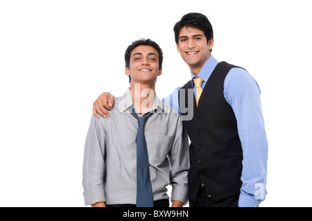 Two smiling businessmen standing together. Stock Photo