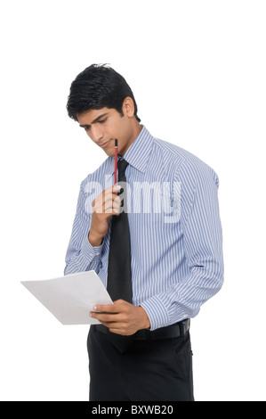 A young man standing facing the camera Stock Photo