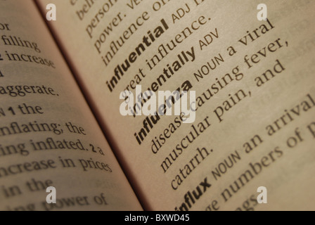 A Photo Illustration of the word Influenza shown in close-up in a dictionary Stock Photo