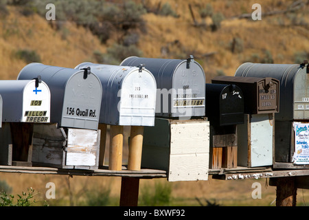 Mailboxes lined up for the delivery of mail in a rural area near Challis, Idaho, USA. Stock Photo