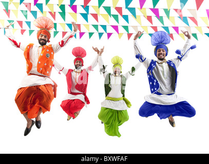 Sikh men jumping in the air Stock Photo