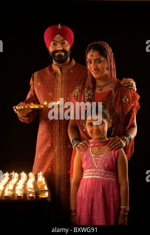 Portrait of a Sikh family with diyas Stock Photo