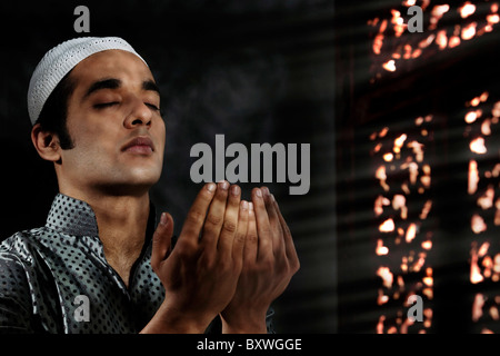 Muslim man praying Stock Photo