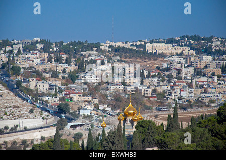 A view of Jerusalem, with the gold domes of the church of St. Mary Magdalene in the foreground. Stock Photo