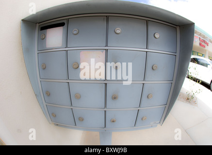 free standing metal mail box, Post office box, next to an apartment building, USA Stock Photo
