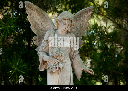 USA, Georgia, Savannah, Graveyard statue of angel in shady grove inside Bonaventure Cemetery on summer morning Stock Photo