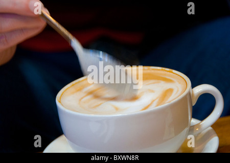 Café latte in cup on restaurant table Stock Photo