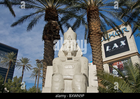 A statue of a pharaoh sits among palm trees outside the Luxor Hotel in Las Vegas Stock Photo