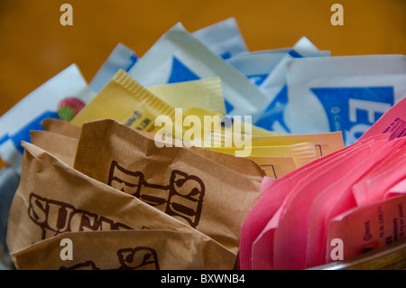 Packets of sugar and artificial sweeteners Stock Photo