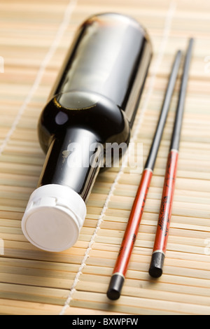 the photo shot of soy sauce and chopsticks Stock Photo