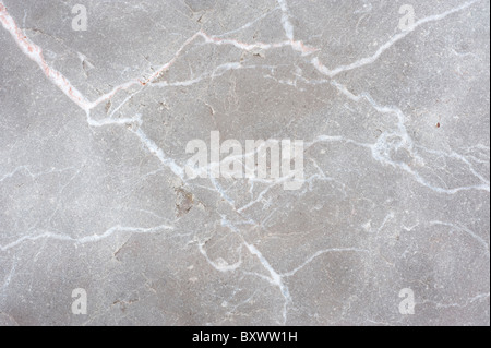 patterns in granite worn smooth by the sea Stock Photo