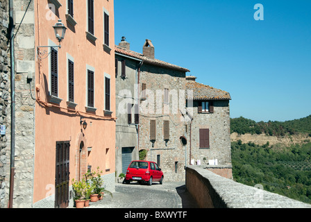 Red car parked in the Umbrian town of Ficulle, Italy Stock Photo