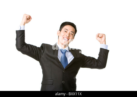 Businessman arms raised in celebration Stock Photo
