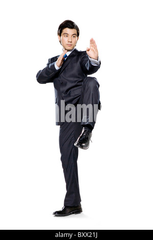 Businessman in fighting stance with hands up Stock Photo