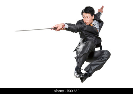 Businessman with sword Stock Photo