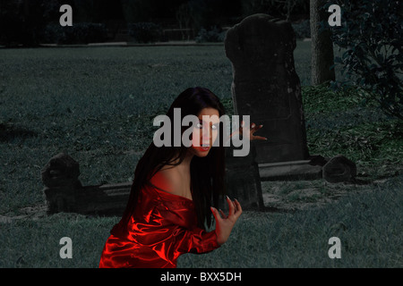 Teen Vampire at a Grave Stone Stock Photo