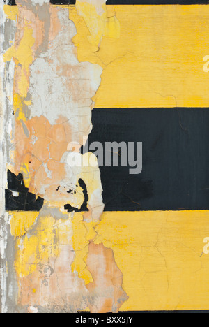 detail of peeling off pain from a parking lot's wall Stock Photo