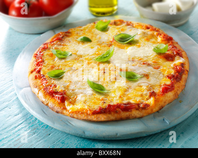 Pizza topped with 3 cheeses, & basil.n A Margarita Neopolitan Pizza. Stock Photo