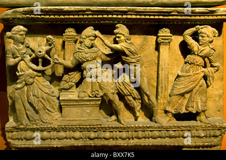 Ancient Etruscan alabaster cinerary urn panel depicting the mythological Death of Myrtilus from Volterra at the Archaeological Museum of Milan Italy Stock Photo