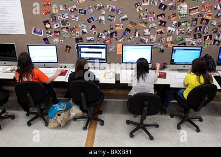Girls do classwork in computer lab at McCamey High School in McCamey, Texas, USA Stock Photo