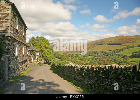 A view down the main street at Troutbeck in the English Lake District  looking towards the peaks of Yoke, Ill Bell and Froswick Stock Photo