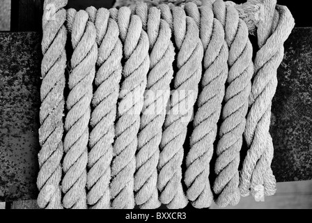 Old rope on the rusty piece of metal. Stock Photo