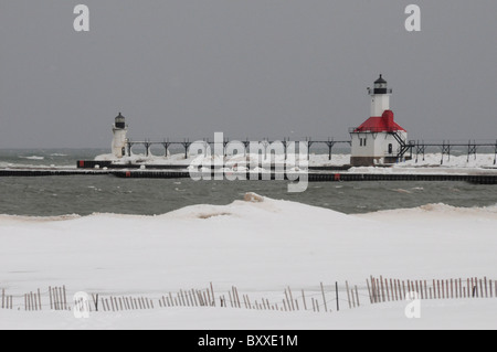 Silver Beach; St Joseph North Pier Lights on Lake Michigan; Winter; Snow and Ice; St Joseph Michigan USA Stock Photo