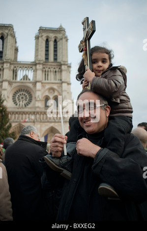 Paris, France, Coptic Christians Demonstrating at Notre Dame Cathedral, Terrorist Attacks in Egypt, religious meeting, Dad with Child holding Cross on Street, different cultures religion, Christian ACTIVISM Stock Photo