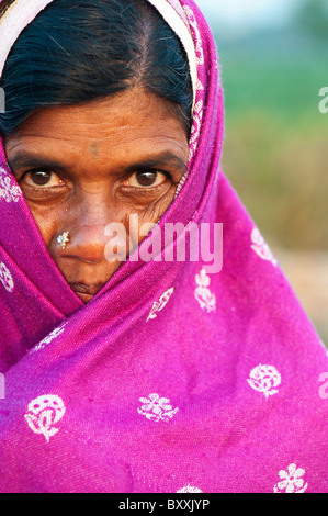 Indian woman wrapped in a pink shawl, keeping warm in winter. Andhra Pradesh, India Stock Photo