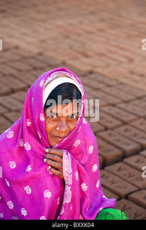 Indian woman wrapped in a pink shawl, keeping warm in winter. Andhra Pradesh, India Stock Photo