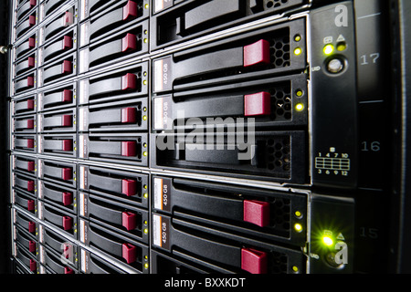 Row of hard drives mounted in a rack in a data center Stock Photo