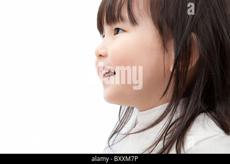 Beautiful asian little girl watch and smiling isolated on white background Stock Photo