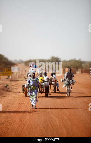 People from villages around the region come to Djibo's weekly Wednesday market in northern Burkina Faso to buy and sell goods. Stock Photo