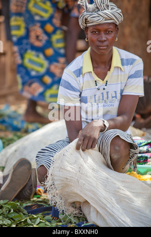 In the town of Djibo in northern Burkina Faso, women sell greens in the market. Stock Photo