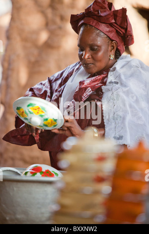 A woman attends a Fulani 'bantule' in the town of Djibo in northern Burkina Faso, when the bride moves into the groom's home. Stock Photo