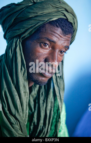 In northern Burkina Faso, a group of griots call on a Fulani family to recite family histories through poetry, song, and music. Stock Photo