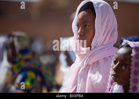 On the morning of Tabaski, men, women, and children alike converge on the great mosque of Djibo in northern Burkina Faso. Stock Photo