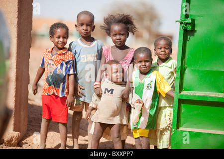 Fulani children in the town of Djibo in northern Burkina Faso. One girl sports a Barack Obama t-shirt. Stock Photo