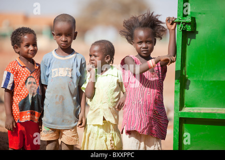 Fulani children in the town of Djibo in northern Burkina Faso. One girl sports a Barack Obama t-shirt. Stock Photo